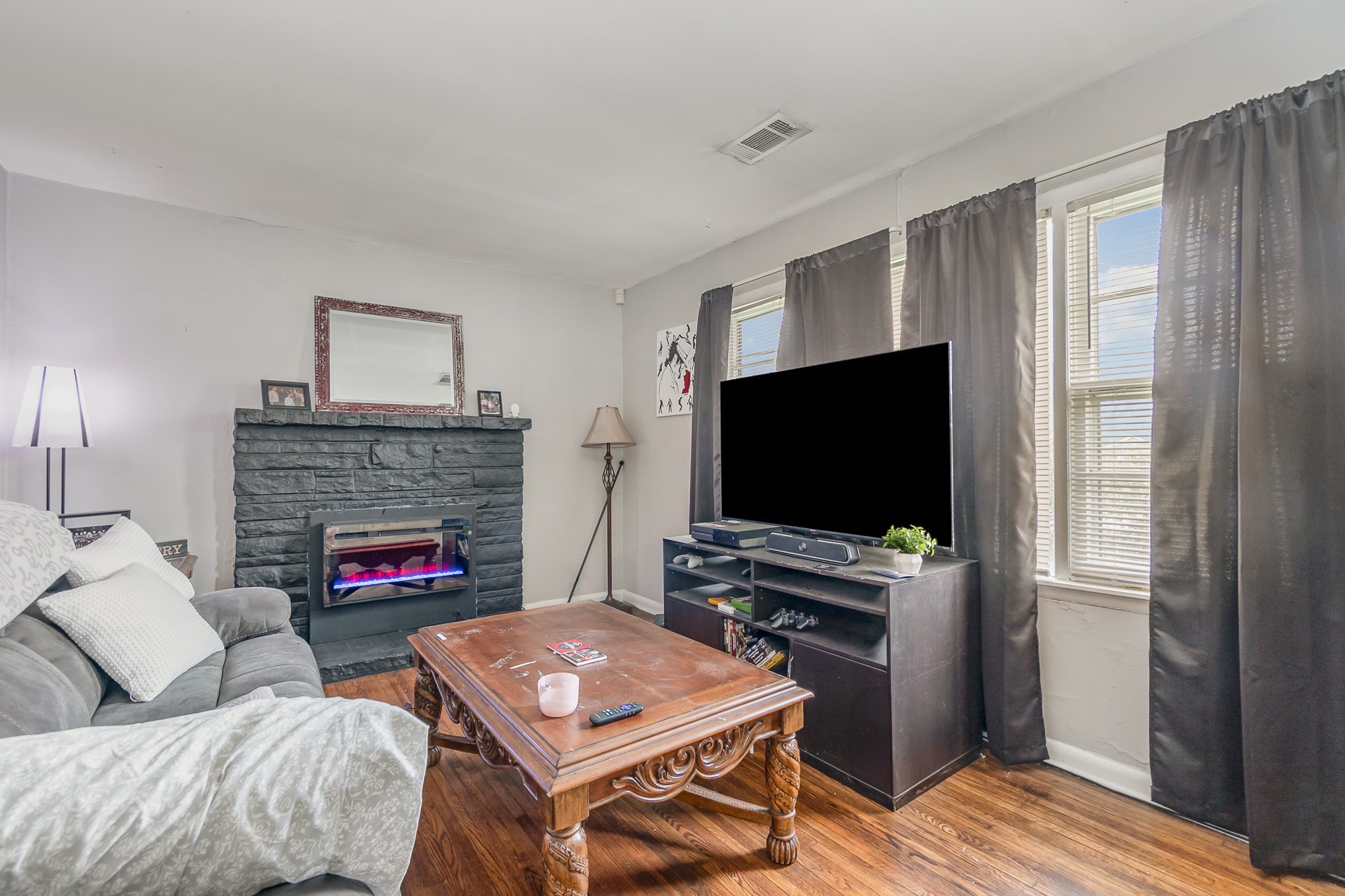 413 Dorris Avenue Springfield, TN 37172 - Photo 6 of 18 a living room with furniture a flat screen tv and a fireplace