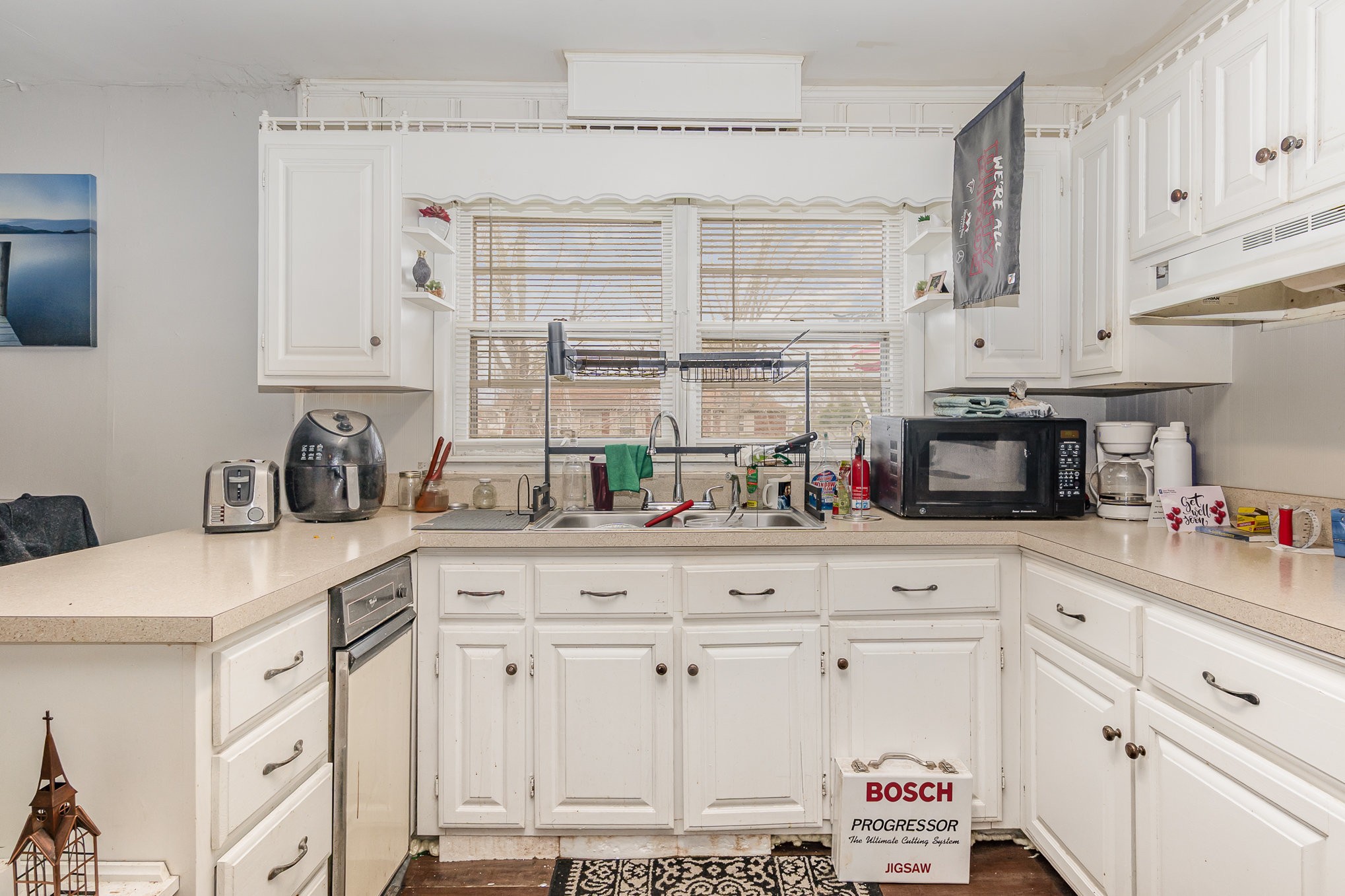 413 Dorris Avenue Springfield, TN 37172 - Photo 8 of 18 a kitchen with stainless steel appliances granite countertop a sink and cabinets
