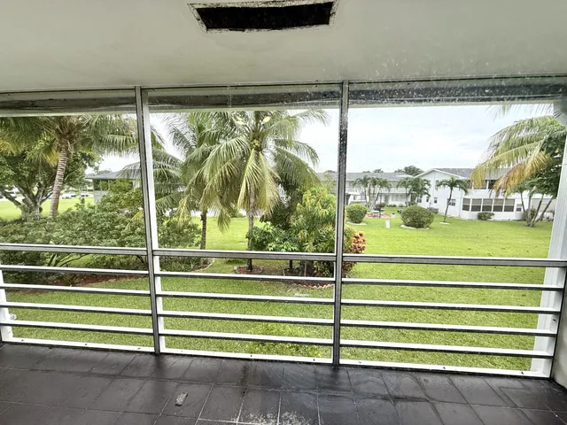 a view of a swimming pool with outdoor seating