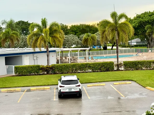 an aerial view of residential houses with outdoor space and river