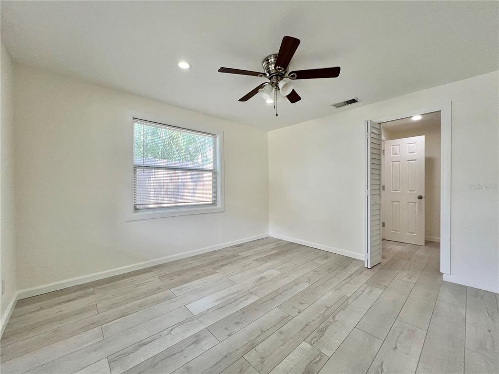 1716 West Nassau Street Tampa, FL 33607 - Photo 16 of 25 wooden floor in an empty room with a window