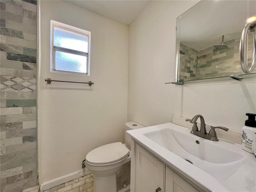1716 West Nassau Street Tampa, FL 33607 - Photo 17 of 25 a bathroom with a sink and a mirror