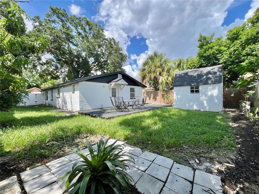1716 West Nassau Street Tampa, FL 33607 - Photo 25 of 25 a view of a house with a yard and a garden