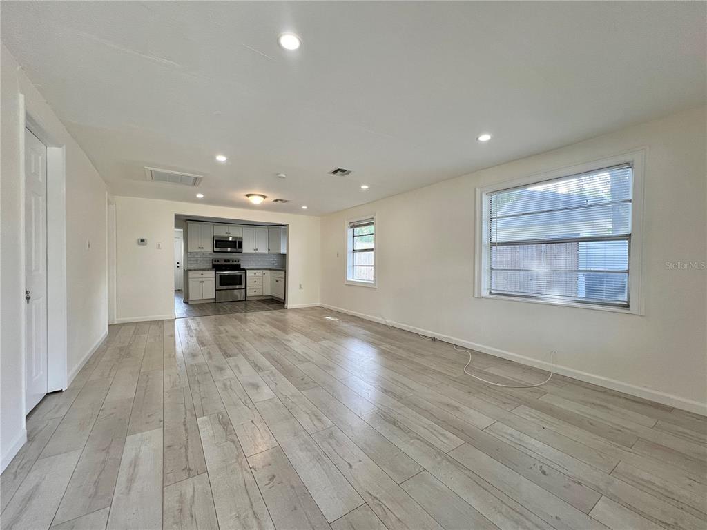 1716 West Nassau Street Tampa, FL 33607 - Photo 4 of 25 a view of empty room with wooden floor and window
