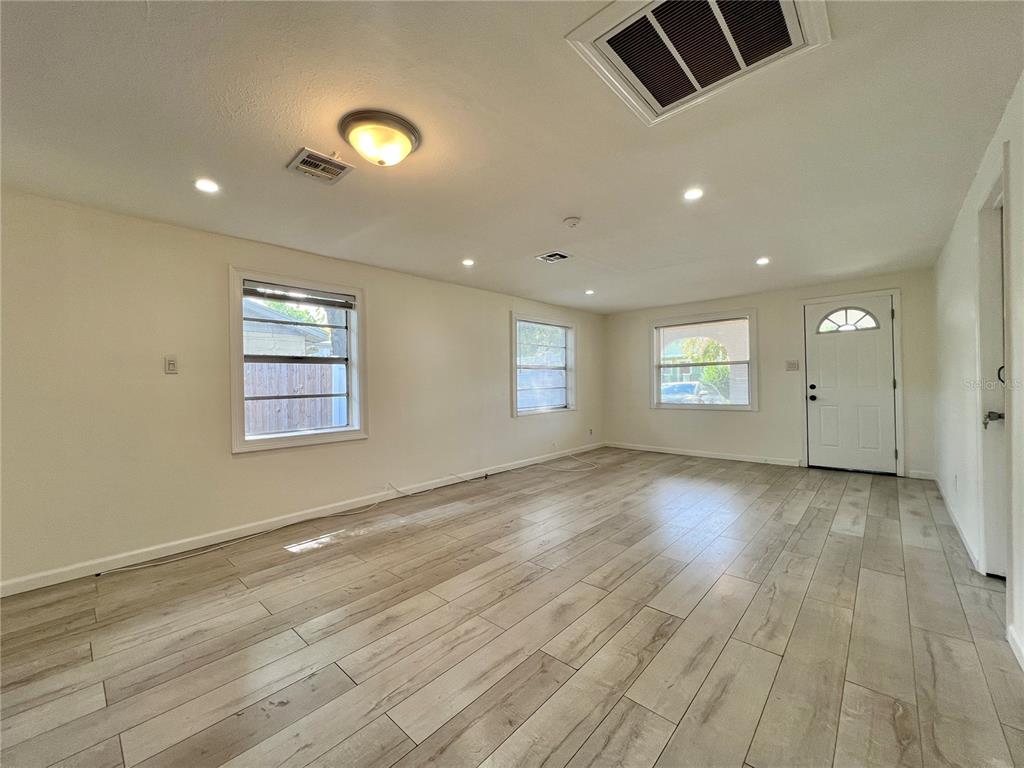 1716 West Nassau Street Tampa, FL 33607 - Photo 5 of 25 an empty room with windows and entrance