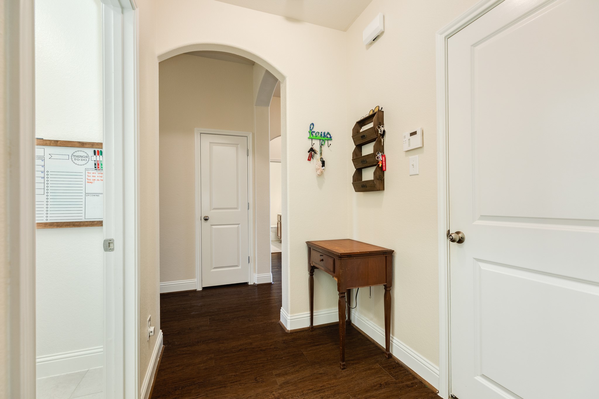 3519 Bay Drive Rosharon, TX 77583 - Photo 7 of 49 Upon entering the front door, the foyer provides immediate access to the garage, laundry room, and guest bedroom located to the left.