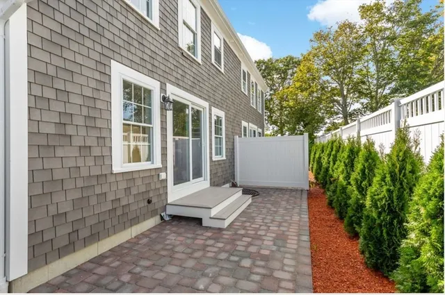 a kitchen with stainless steel appliances granite countertop a stove top oven a sink and dishwasher