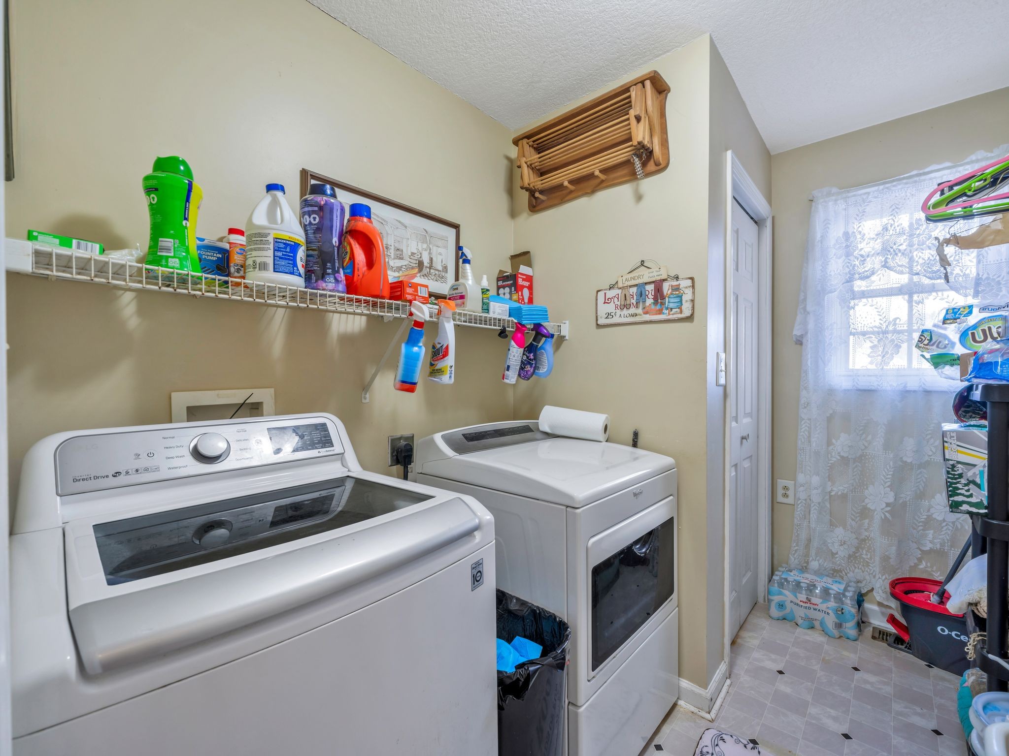 311 Downs Road Cumberland City, TN 37050 - Photo 16 of 31 a utility room with fridge dryer and washer