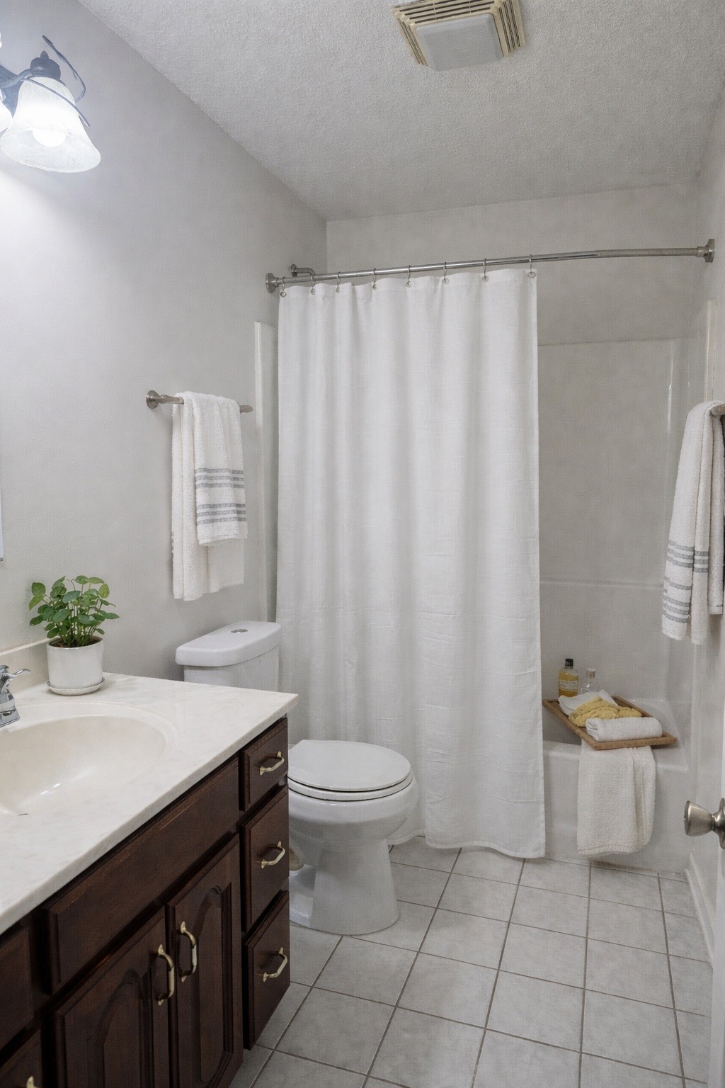 311 Downs Road Cumberland City, TN 37050 - Photo 19 of 31 a bathroom with a sink a toilet and shower
