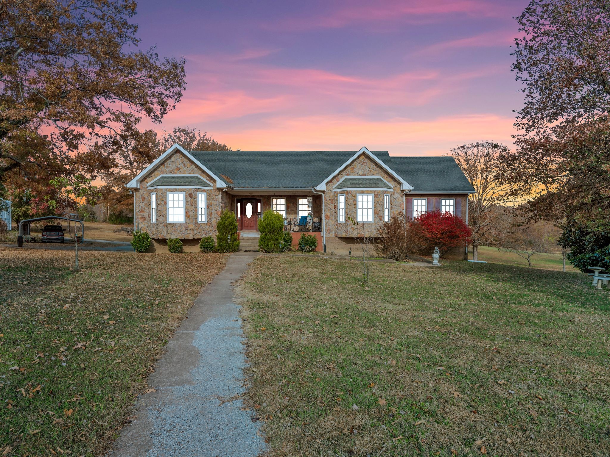 311 Downs Road Cumberland City, TN 37050 - Photo 2 of 31 a front view of a house with a yard