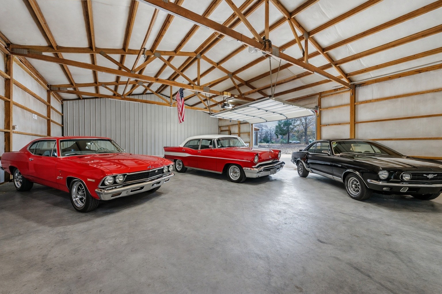 311 Downs Road Cumberland City, TN 37050 - Photo 31 of 31 a car parked in a garage