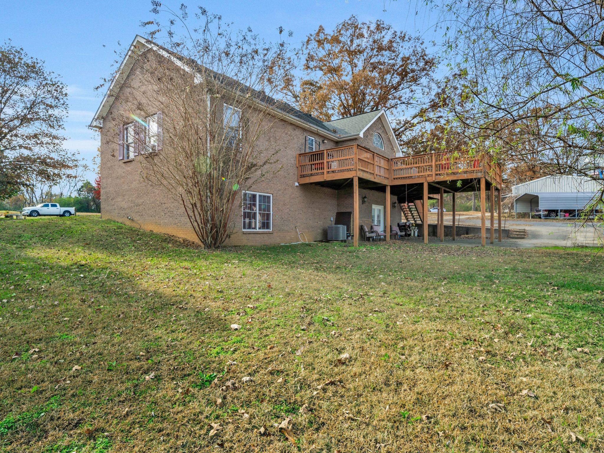 311 Downs Road Cumberland City, TN 37050 - Photo 5 of 31 a view of a house with a yard