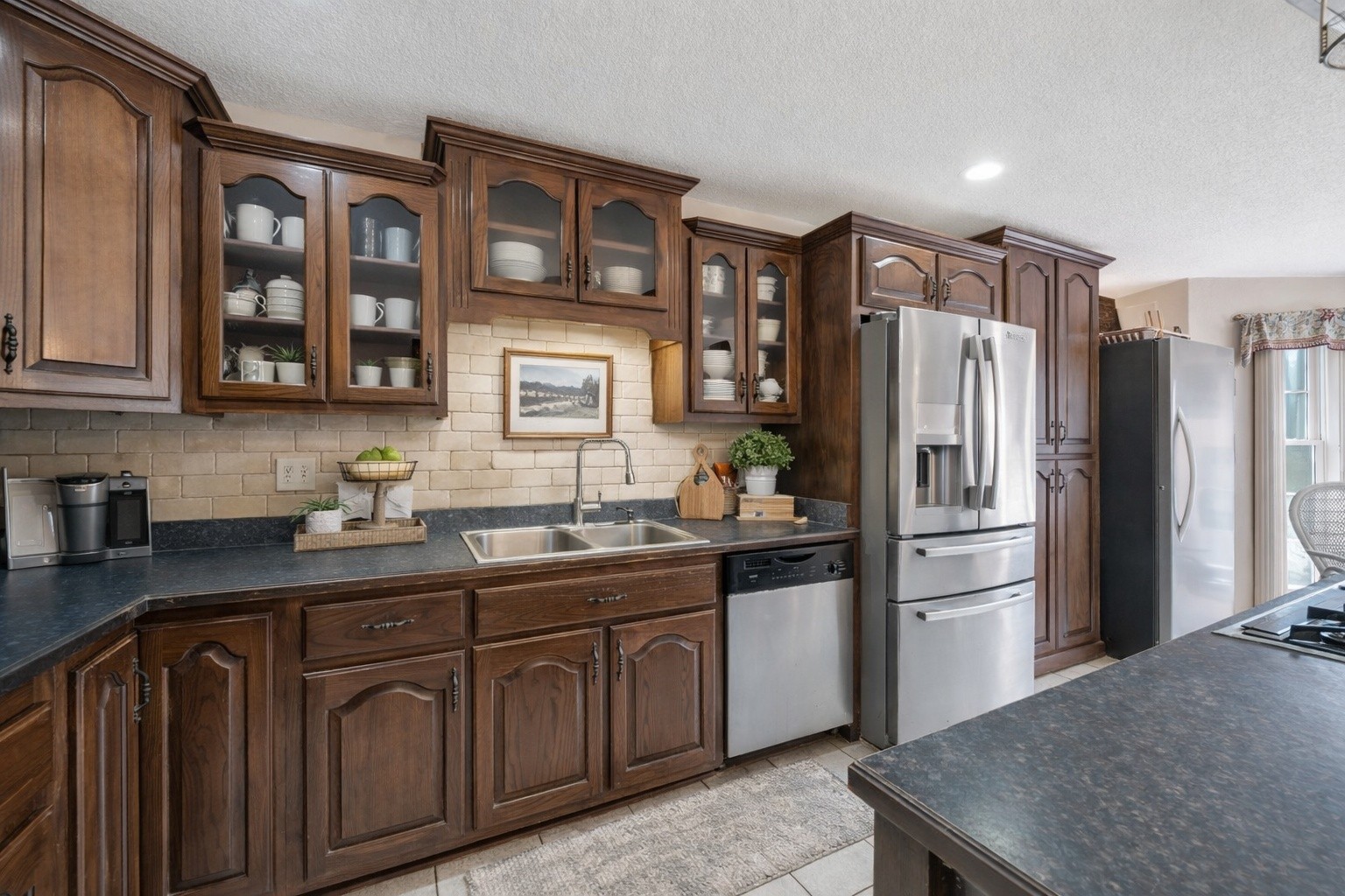 311 Downs Road Cumberland City, TN 37050 - Photo 9 of 31 a kitchen with stainless steel appliances granite countertop a refrigerator and a sink