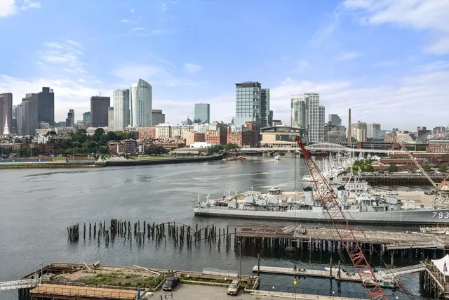 a view of a lake with tall building