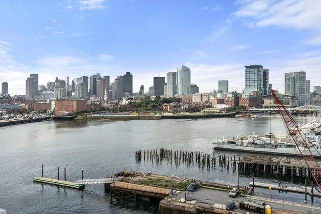 a view of a lake with tall building