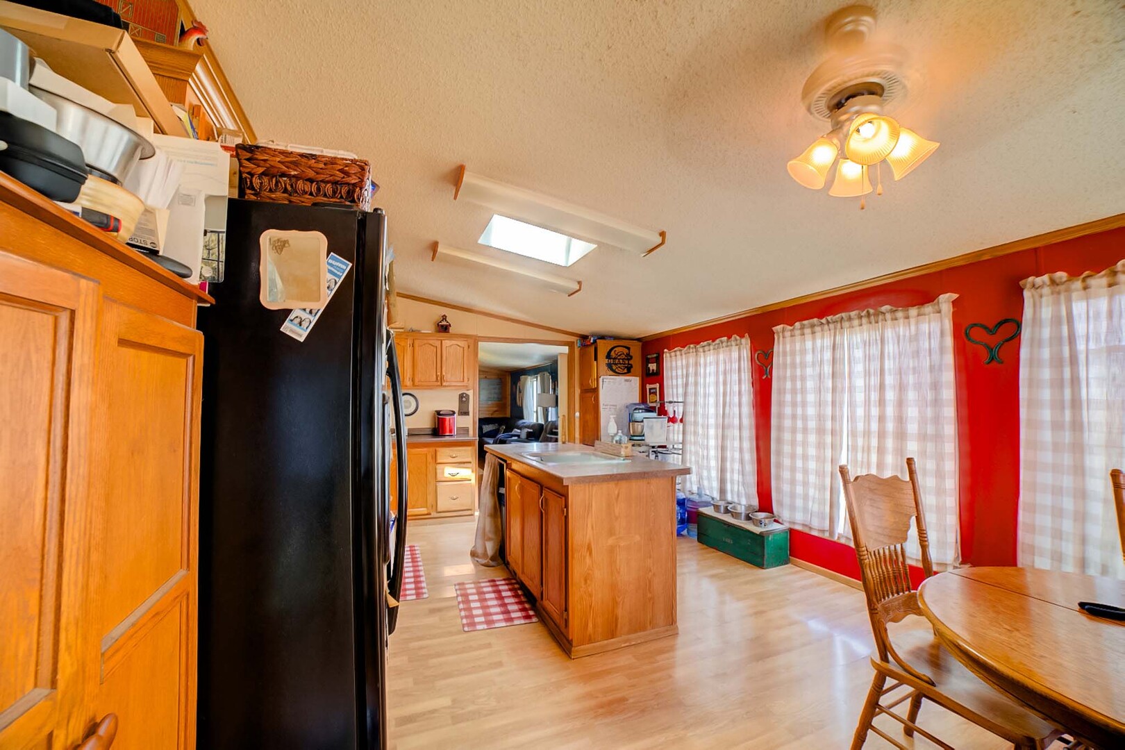 28240 North 990 E Road Potomac, IL 61865 - Photo 13 of 23 a view of a dining room with furniture a chandelier and wooden floor