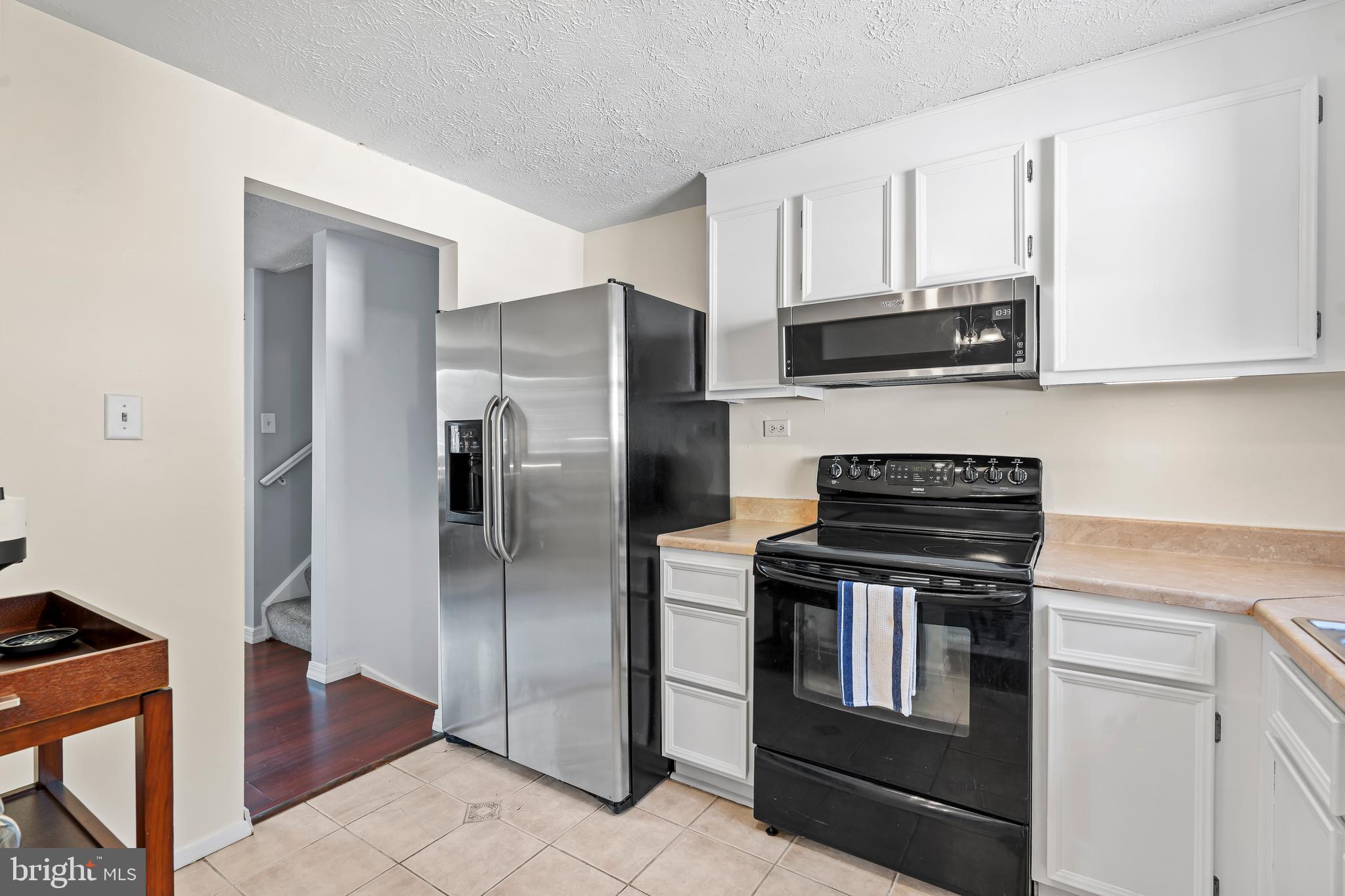 1839 Lawnview Drive Frederick, MD 21702 - Photo 11 of 42 a kitchen with stainless steel appliances granite countertop a refrigerator and a stove top oven
