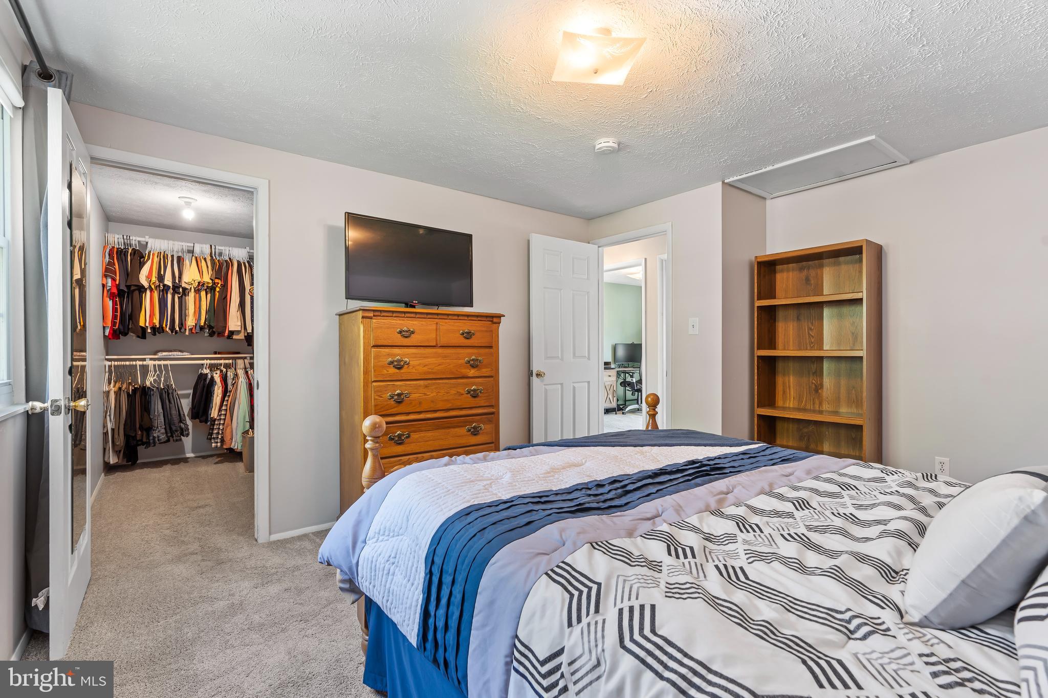 1839 Lawnview Drive Frederick, MD 21702 - Photo 19 of 42 a bedroom with a bed and a television