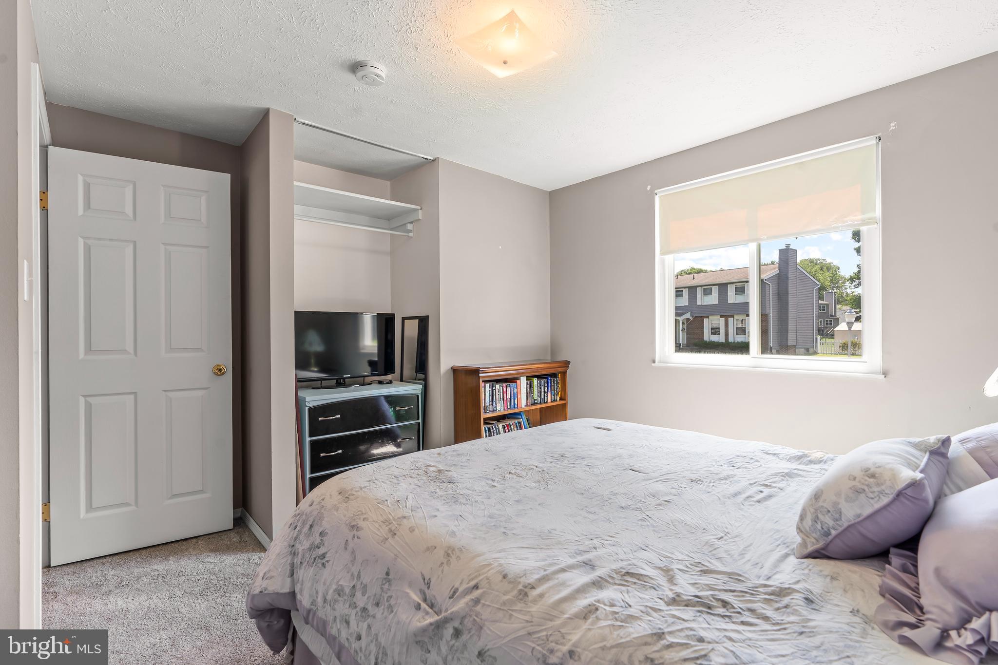 1839 Lawnview Drive Frederick, MD 21702 - Photo 25 of 42 a large bedroom with a bed and a television in it