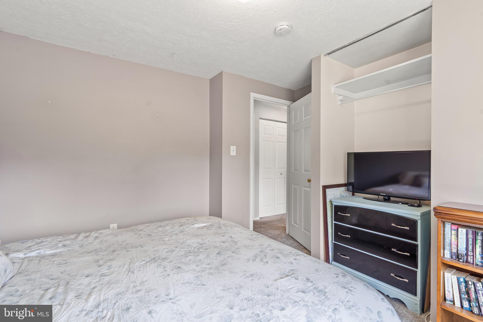 1839 Lawnview Drive Frederick, MD 21702 - Photo 26 of 42 a bedroom with a flat screen tv and a bed