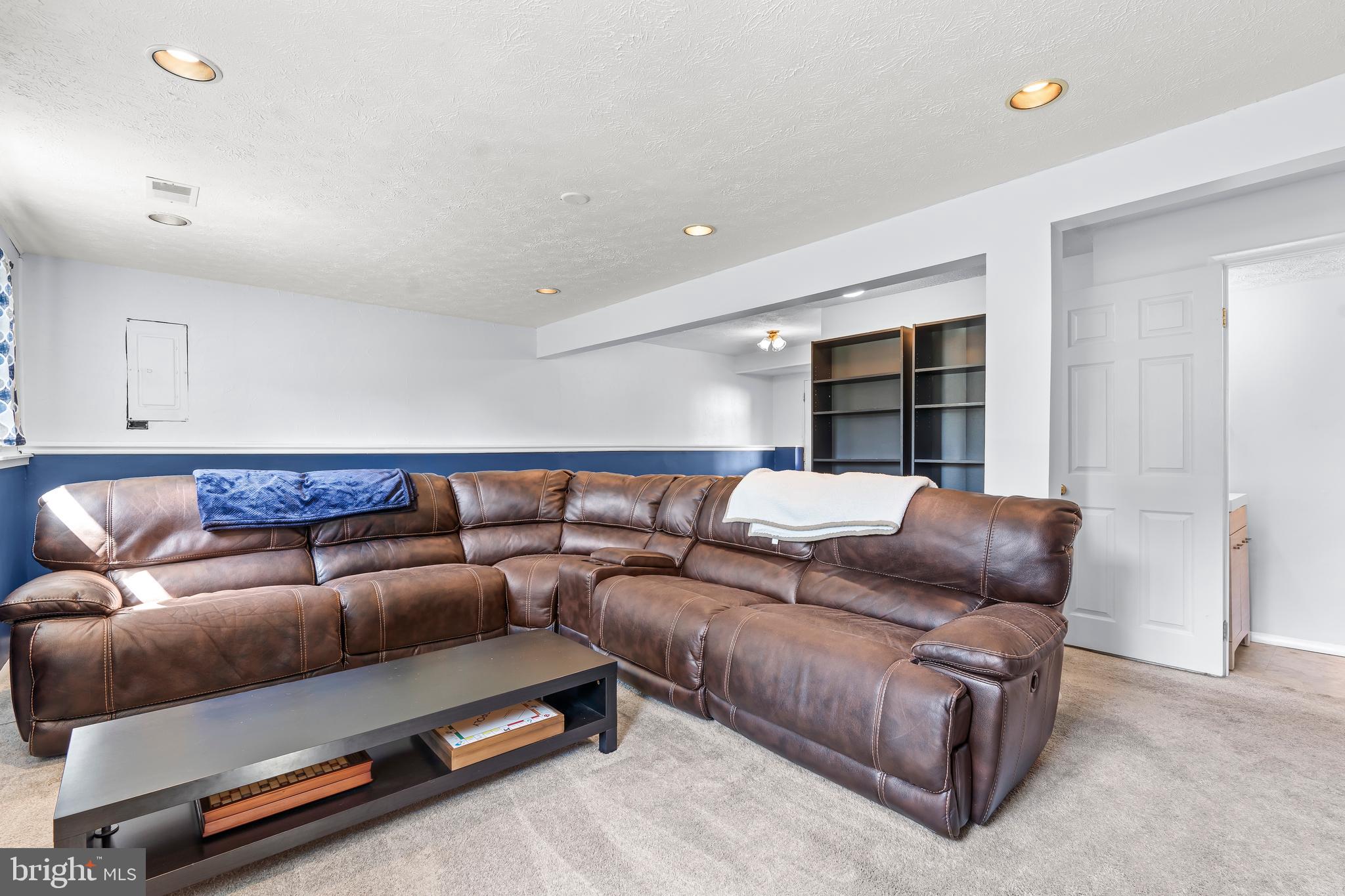 1839 Lawnview Drive Frederick, MD 21702 - Photo 31 of 42 a living room with a couch and a cabinet