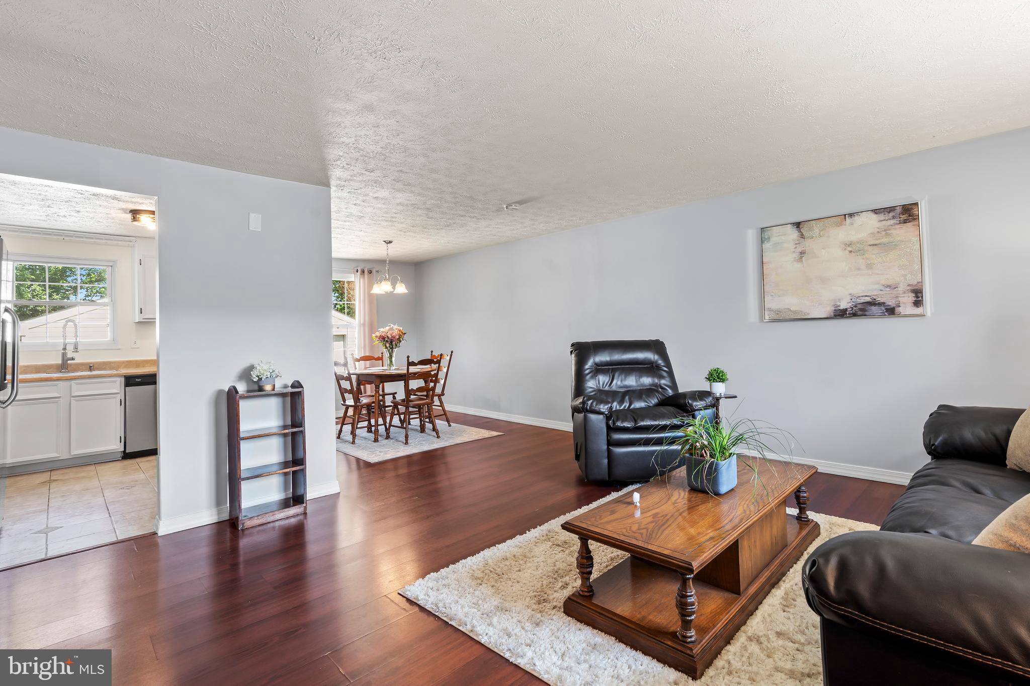 1839 Lawnview Drive Frederick, MD 21702 - Photo 7 of 42 a living room with furniture and wooden floor
