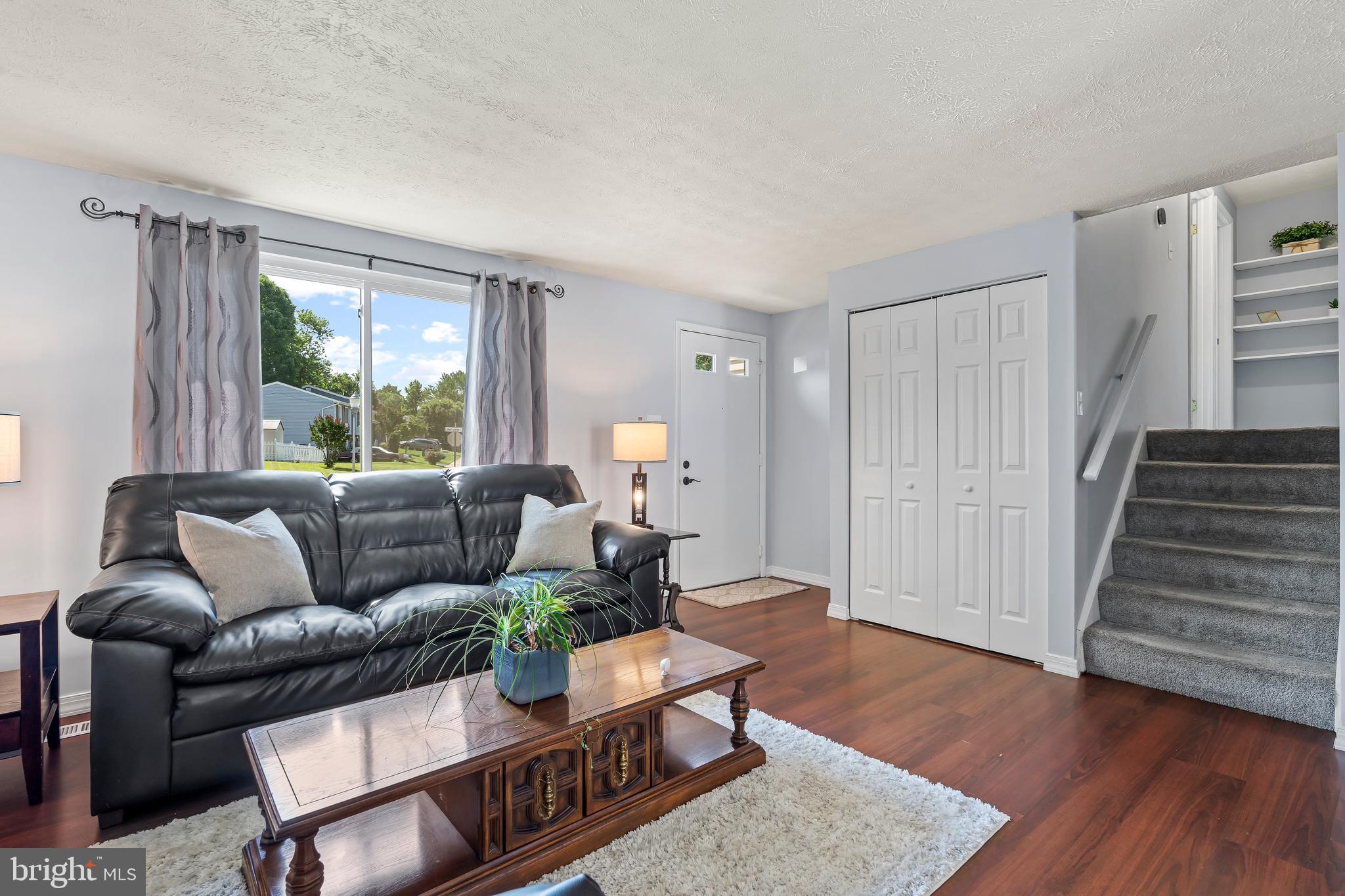 1839 Lawnview Drive Frederick, MD 21702 - Photo 9 of 42 a living room with furniture and wooden floor