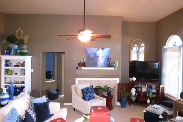 a view of a livingroom with furniture and a flat screen tv