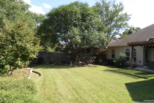 a view of a house with swimming pool and sitting area