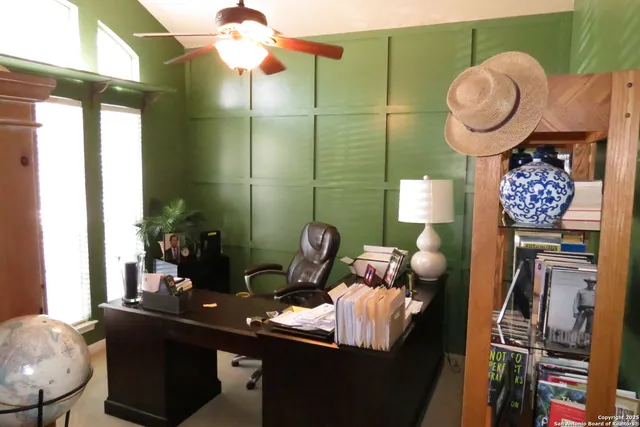 a bathroom with a sink mirror and vanity