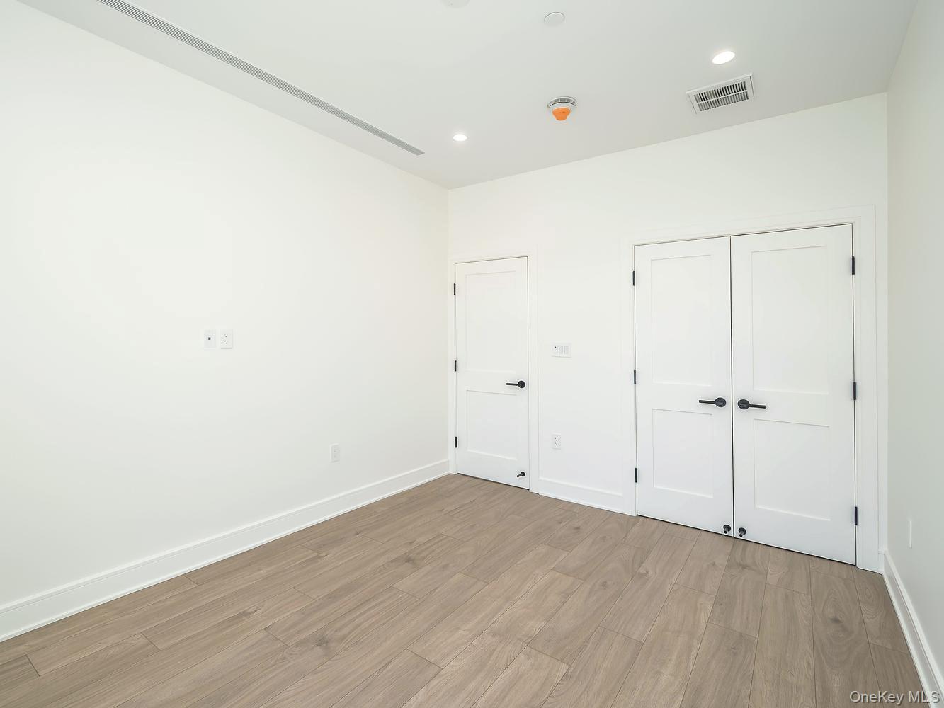 24 Lumber Road, Unit 2 Roslyn, NY 11576 - Photo 20 of 25 a view of an empty room