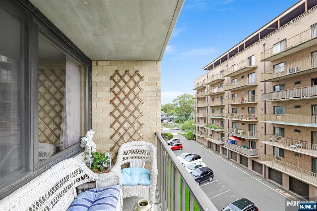 344 Prospect Avenue, Unit 4C Hackensack, NJ 07601 - Photo 19 of 19 a living room with furniture and a book shelf