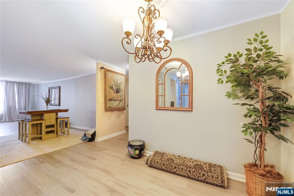344 Prospect Avenue, Unit 4C Hackensack, NJ 07601 - Photo 7 of 19 a view of a livingroom with furniture and window