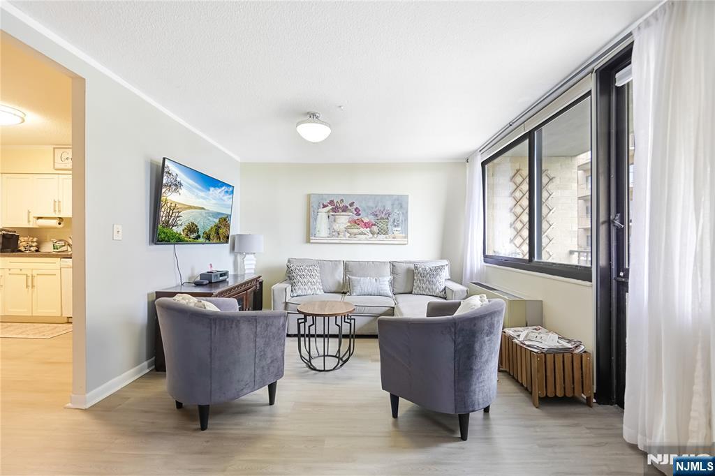 344 Prospect Avenue, Unit 4C Hackensack, NJ 07601 - Photo 8 of 19 a living room with furniture and a window