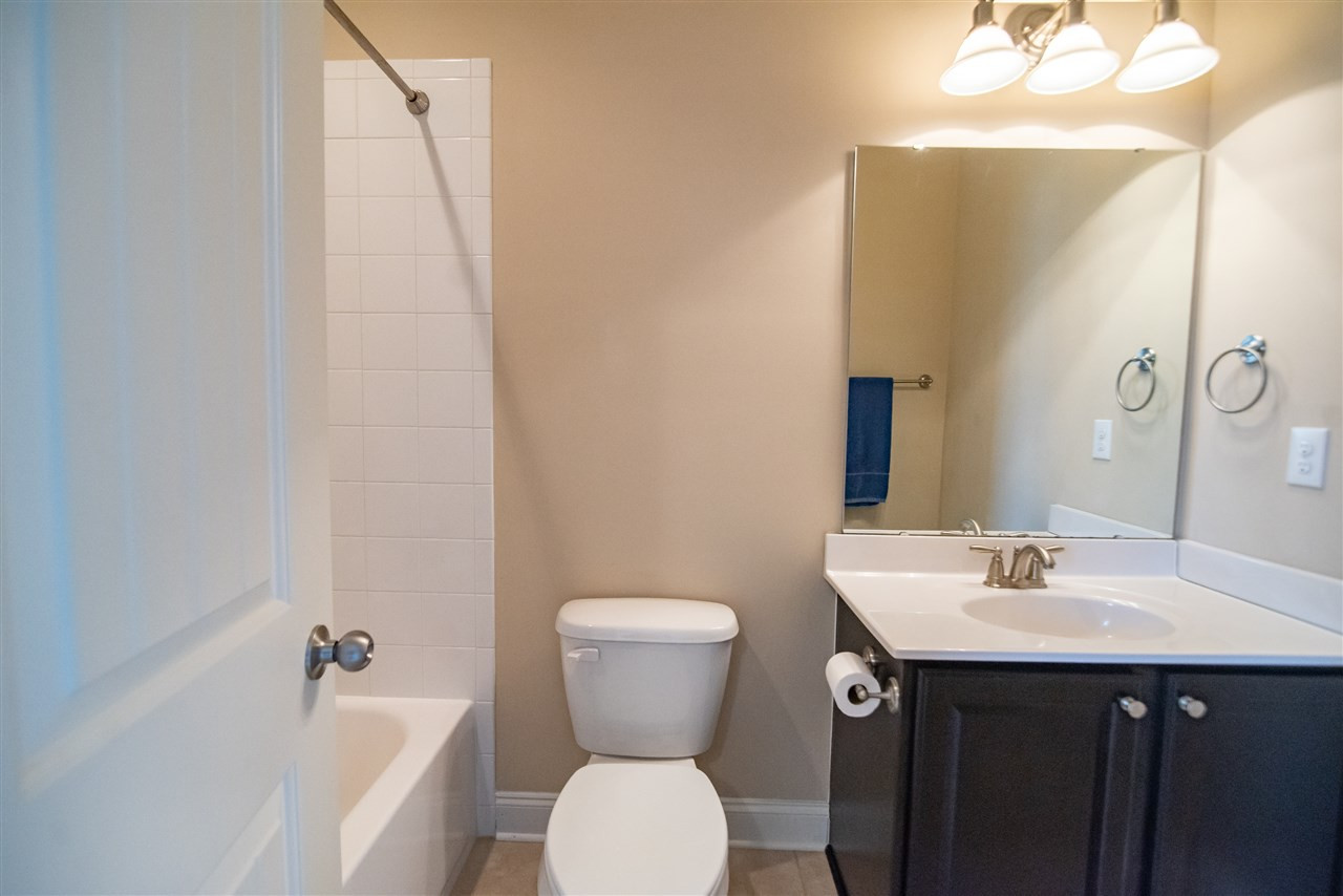 2720 Country Charm Road Raleigh, NC 27614 - Photo 17 of 30 Private second floor bathroom with single vanity sink and tub/shower. Bathroom