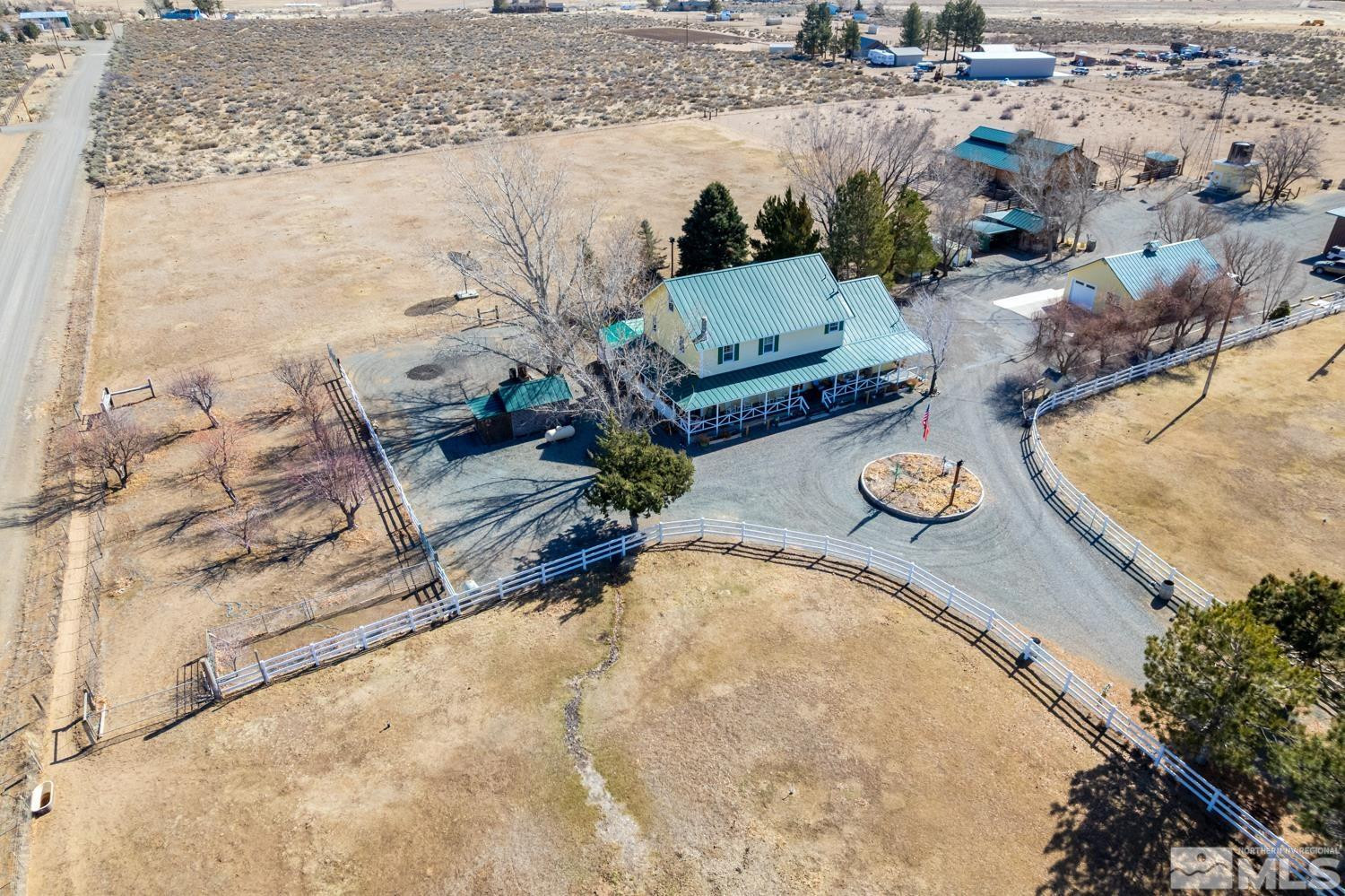 50 Miller Ridge Road Smith Valley, NV 89444 - Photo 21 of 51 a view of a swimming pool with some plants and seating area