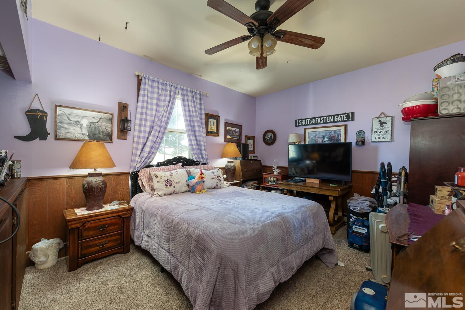 50 Miller Ridge Road Smith Valley, NV 89444 - Photo 45 of 51 a bedroom with a bed and a flat screen tv
