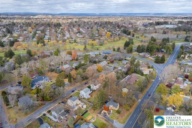 a kitchen with stainless steel appliances granite countertop a refrigerator a stove top oven a sink and dishwasher