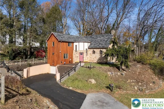 a front view of a house with large windows