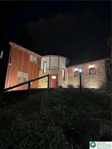 an aerial view of a house with swimming pool