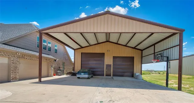 a view of building with car parked