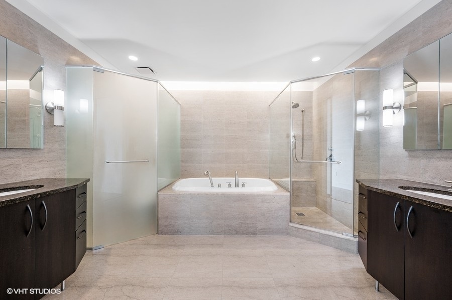 401 North Wabash Avenue, Unit 86D Chicago, IL 60611 - Photo 12 of 42 a bathroom with a sink and a mirror