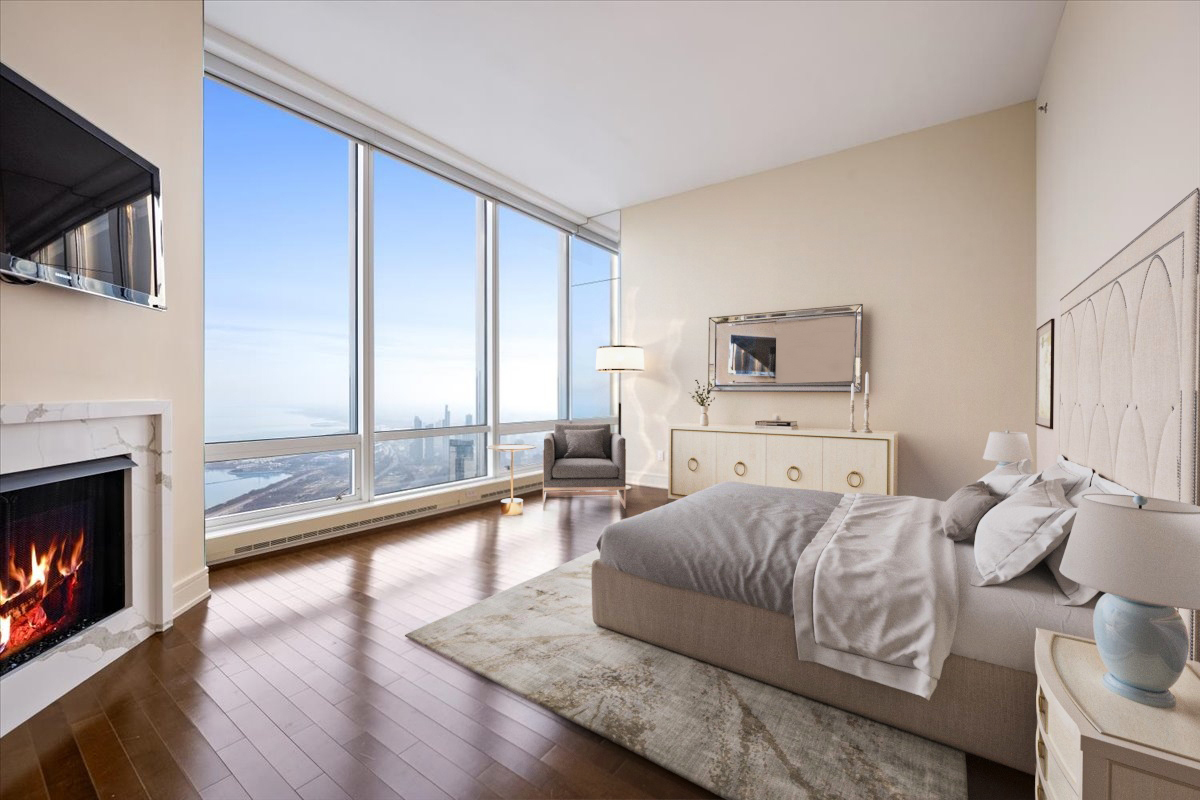 401 North Wabash Avenue, Unit 86D Chicago, IL 60611 - Photo 19 of 50 a spacious bedroom with a large bed and a fireplace