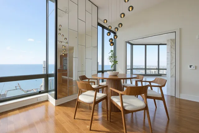 a view of a dining room with furniture window and wooden floor