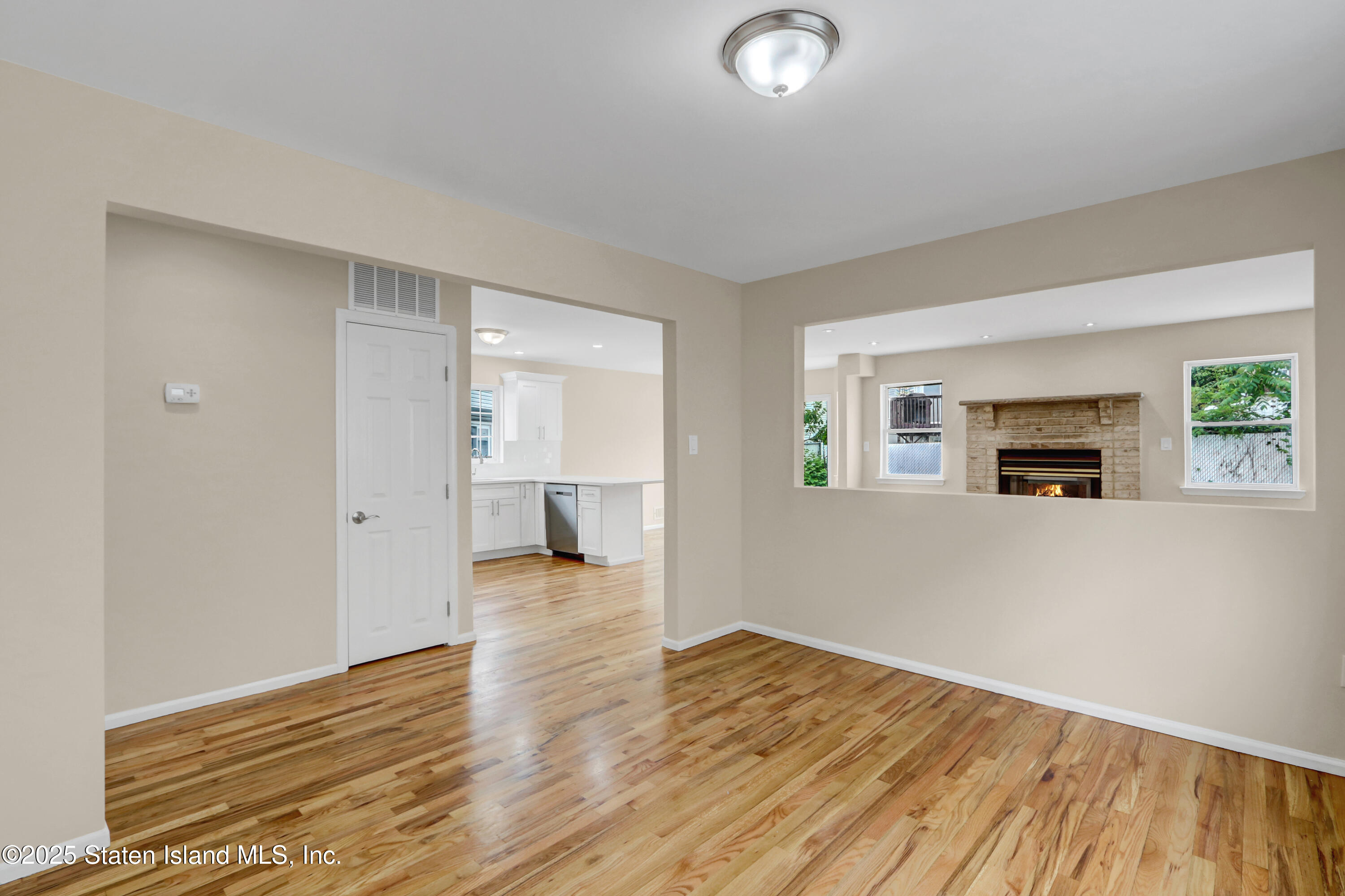 103 Savo Loop Staten Island, NY 10309 - Photo 11 of 46 a view of empty room with wooden floor and fan