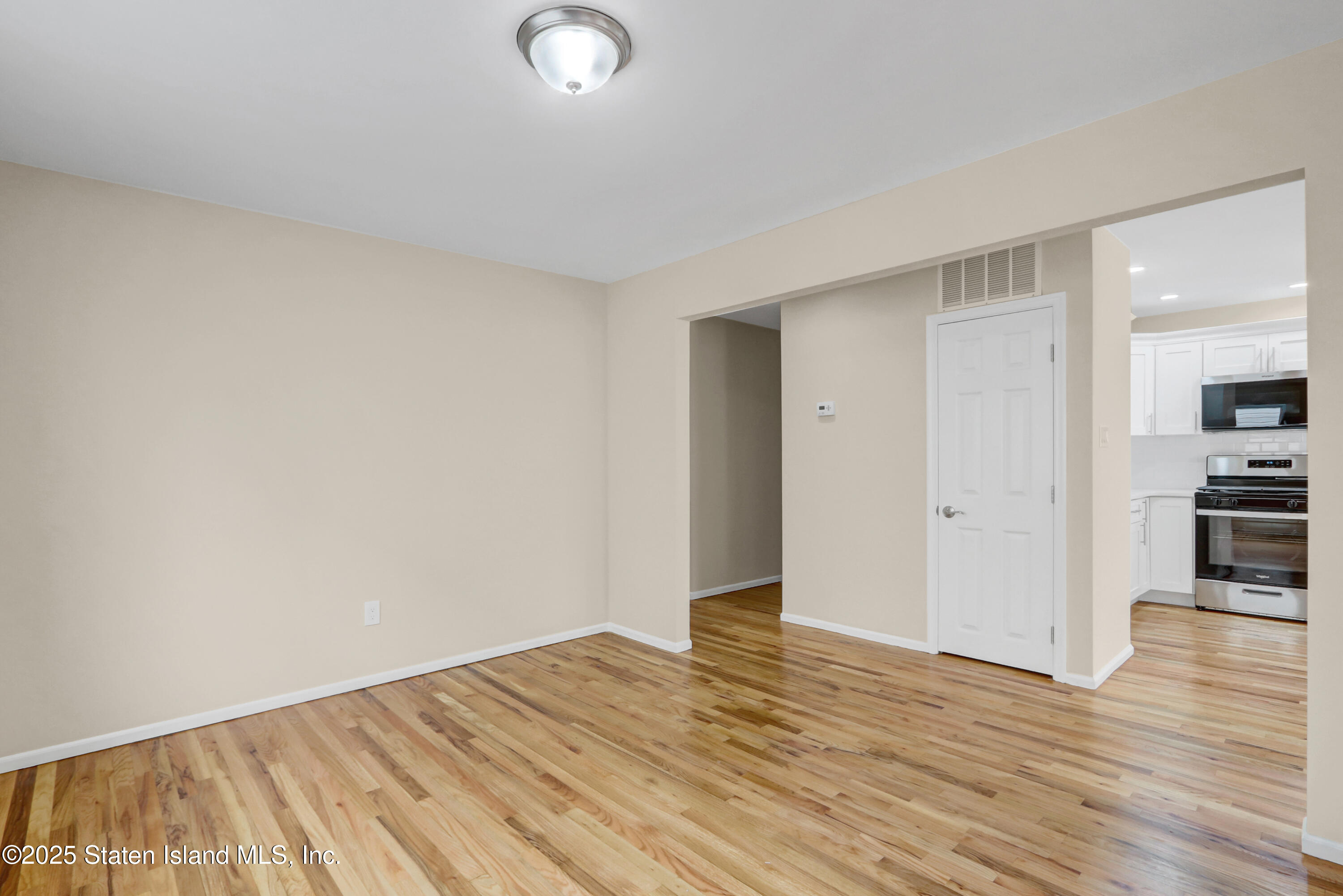 103 Savo Loop Staten Island, NY 10309 - Photo 12 of 46 a view of empty room with wooden floor