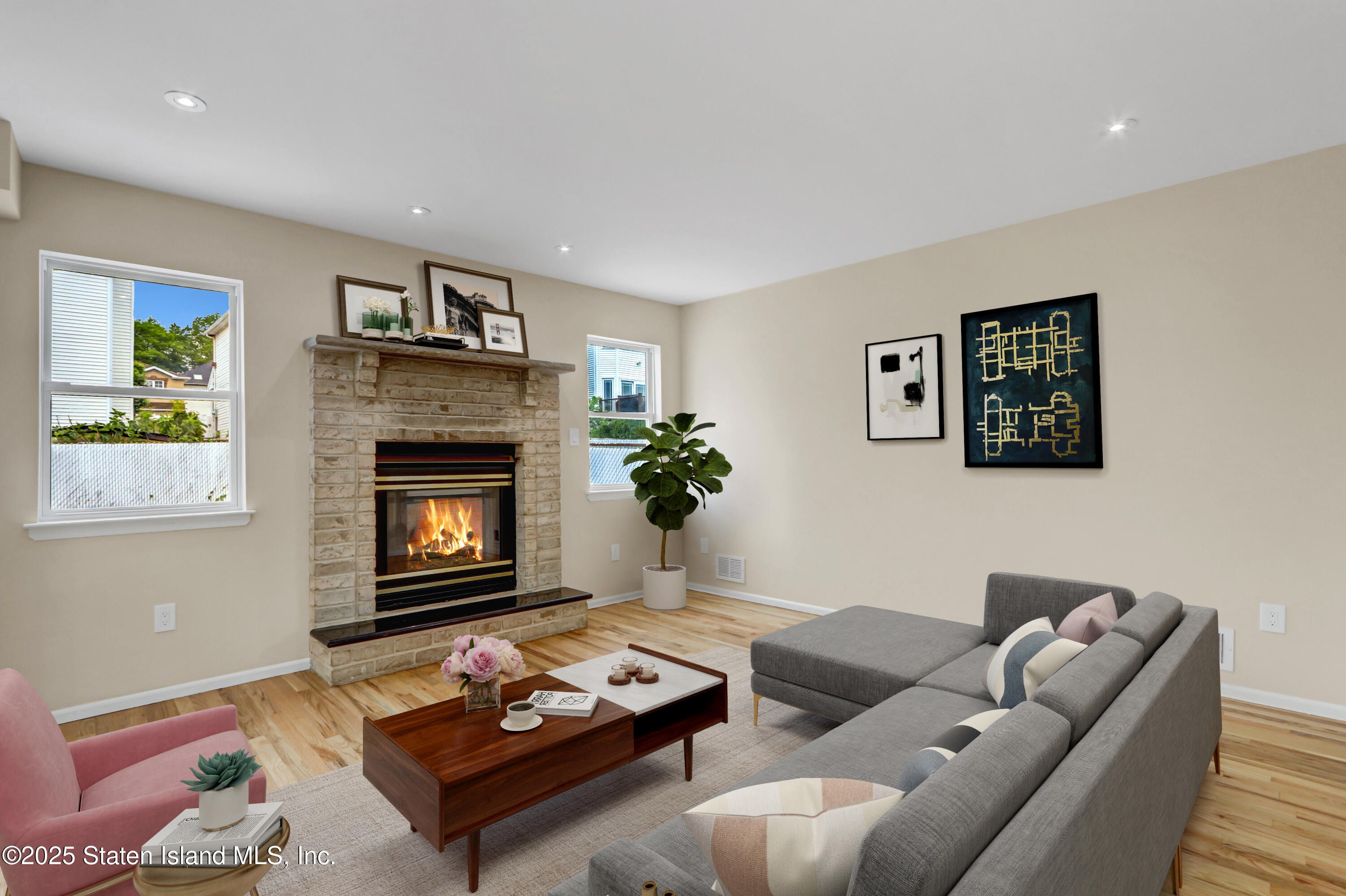 103 Savo Loop Staten Island, NY 10309 - Photo 13 of 46 a living room with furniture and a fireplace