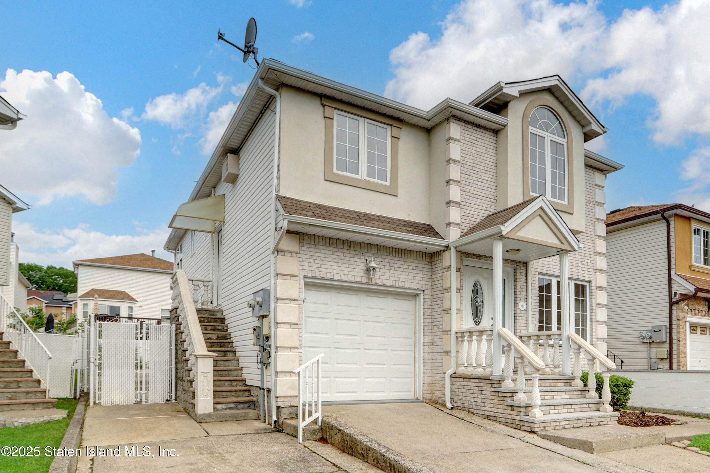 103 Savo Loop Staten Island, NY 10309 - Photo 2 of 46 a front view of a house with a tree