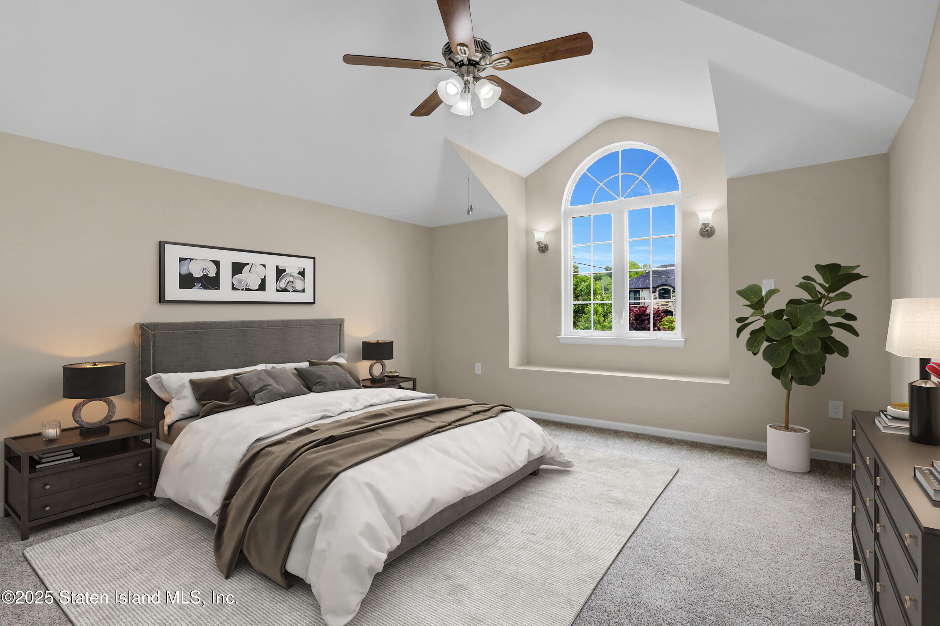 103 Savo Loop Staten Island, NY 10309 - Photo 25 of 46 a bedroom with a bed and a chandelier