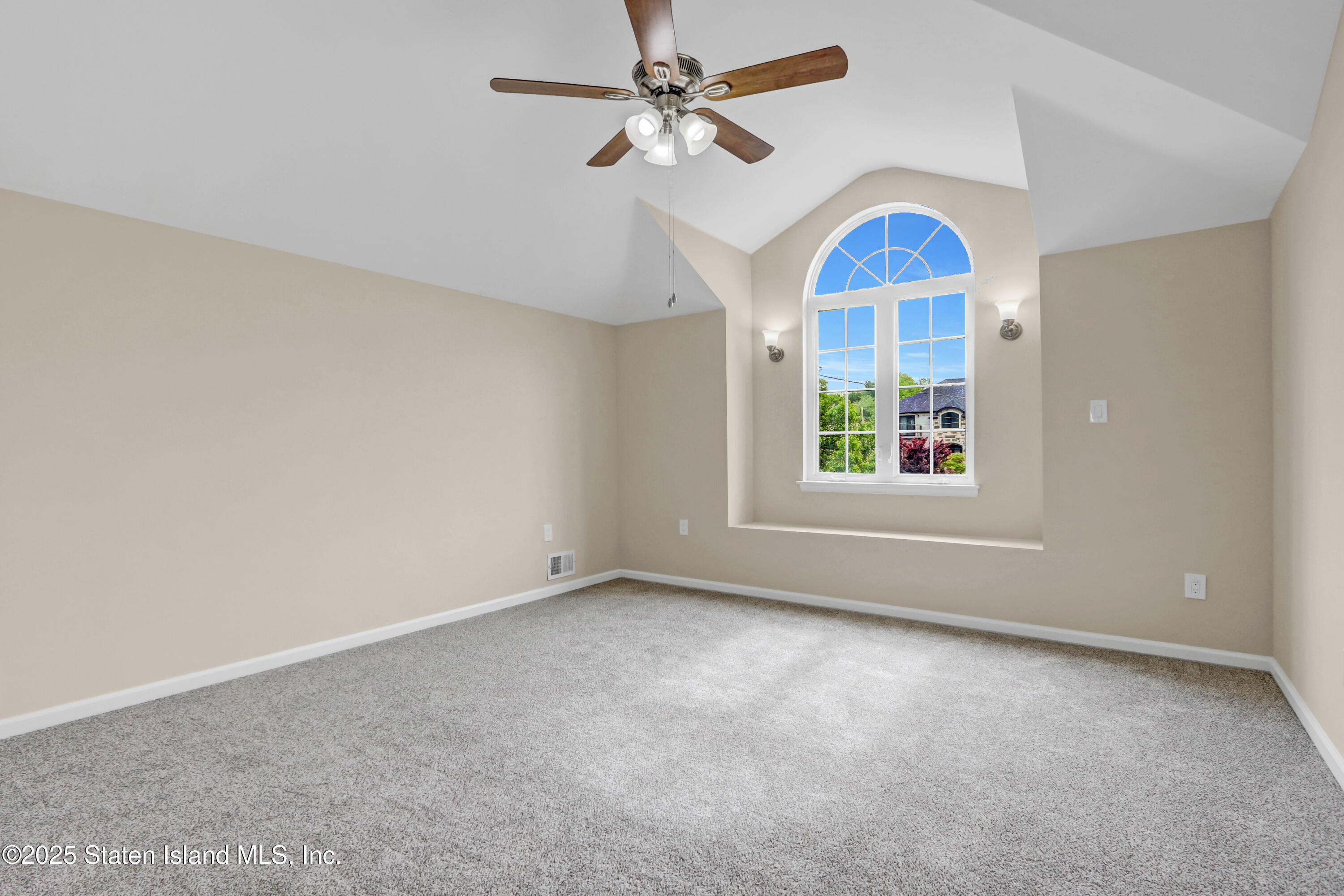 103 Savo Loop Staten Island, NY 10309 - Photo 26 of 46 an empty room with window and ceiling fan